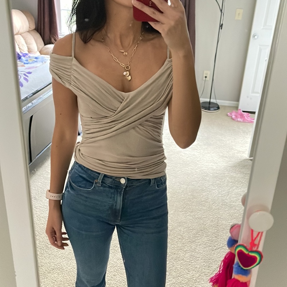 In good condition top in beige